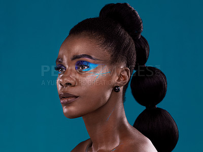 Buy stock photo Idea, makeup and cosmetic with a model black woman in studio on a blue background for hair or beauty. Face, thinking and fashion with an attractive young female person posing to promote cosmetics