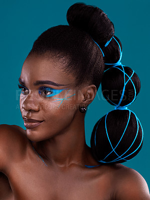 Buy stock photo Studio shot of a beautiful young woman posing against a turquoise background