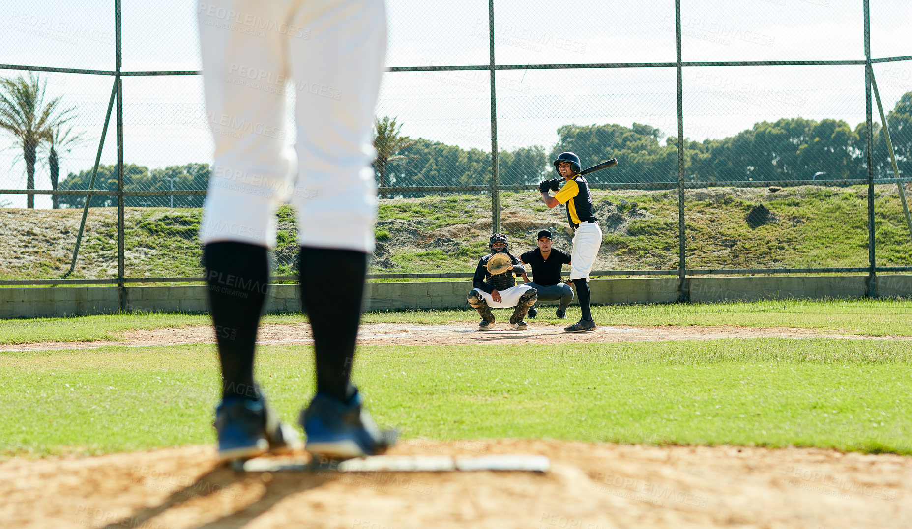 Buy stock photo Cropped shot of a handsome young baseball player preparing to bat a ball during  match on the field