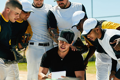 Buy stock photo Cropped shot of a group of young baseball players having a meeting with their coach on the field during the day