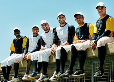 Buy stock photo Cropped portrait of a team of handsome young baseball players sitting near a baseball field
