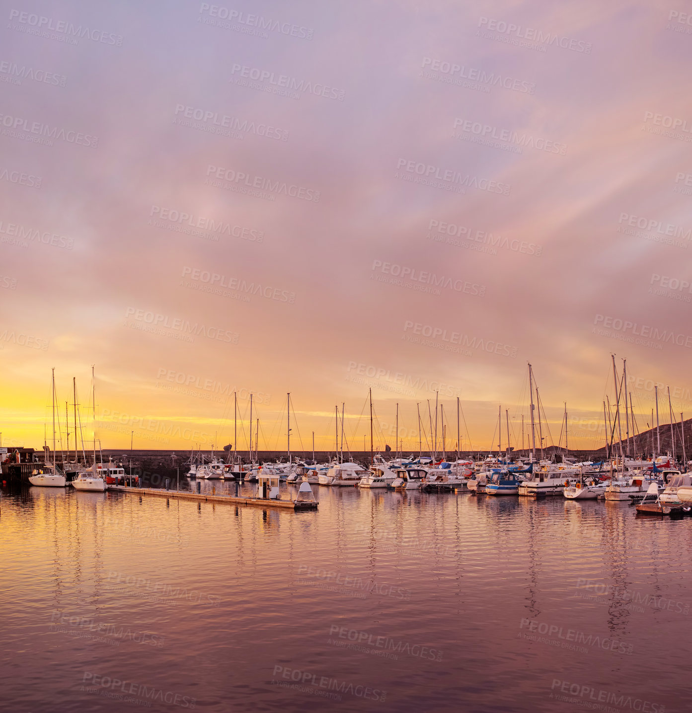 Buy stock photo Scenic view of private yachts docked in water harbor at sunset in Bodo, Norway. Nautical transport vessels and boats in a dockyard in the morning at dawn before sailing on the ocean, sea or lake