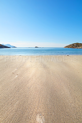 Buy stock photo A relaxing beach on a summer day ideal for vacation. Calm, blue ocean, beige sands with islands in the background.
An isolated coast in the city of Bodoe, north of the Polar Circle