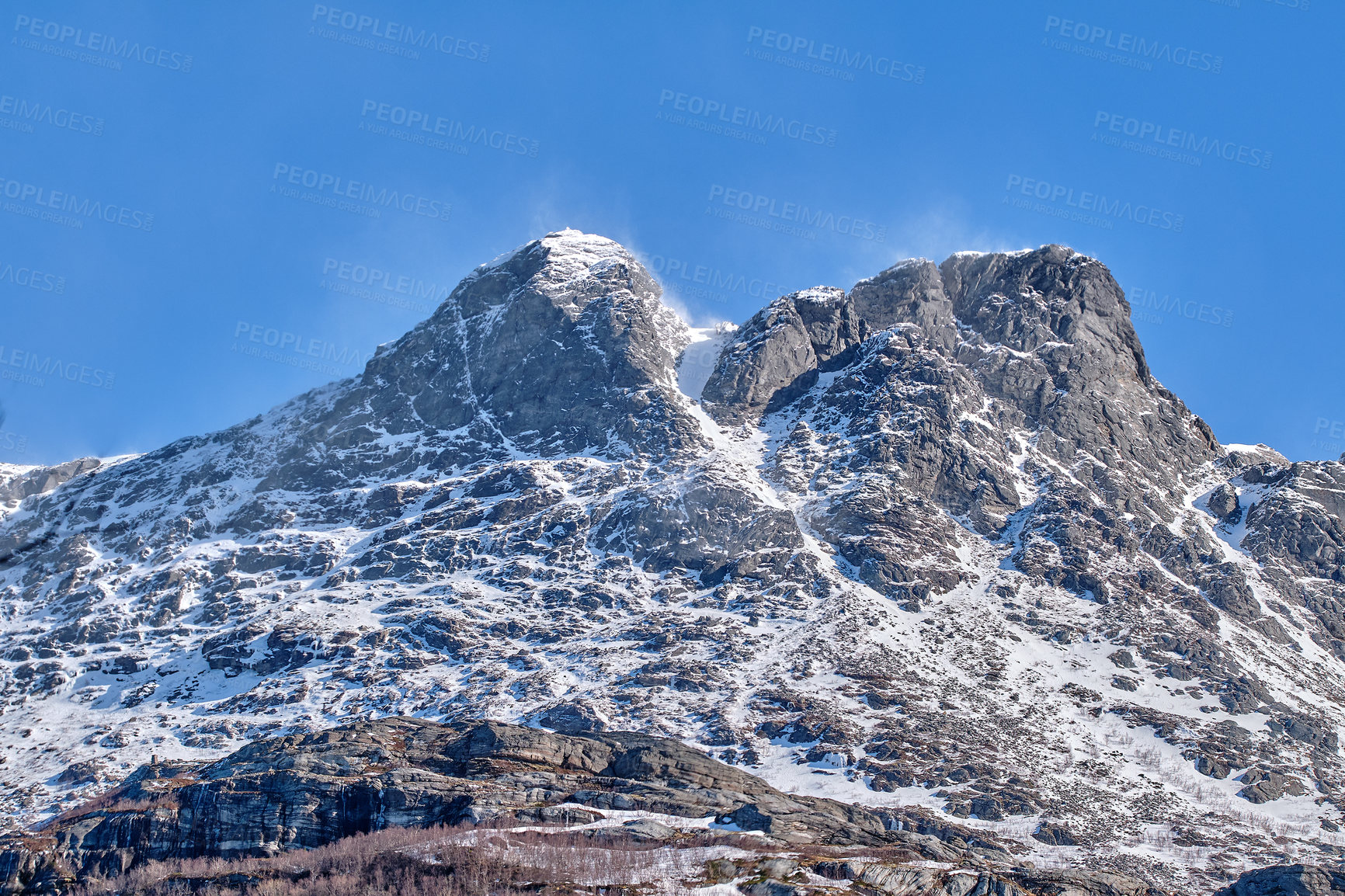 Buy stock photo Scenic panoramic of snow capped mountain landscape in Bodo, Nordland, Norway against a clear blue sky background. Breathtaking and picturesque view of a cold and icy natural environment in winter