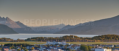 Buy stock photo Scenic landscape of the city of Bodo in Nordland, Norway with lush surroundings, panoramic mountain and clear sky background with copy space. Peaceful coastal suburb with breathtaking views in nature