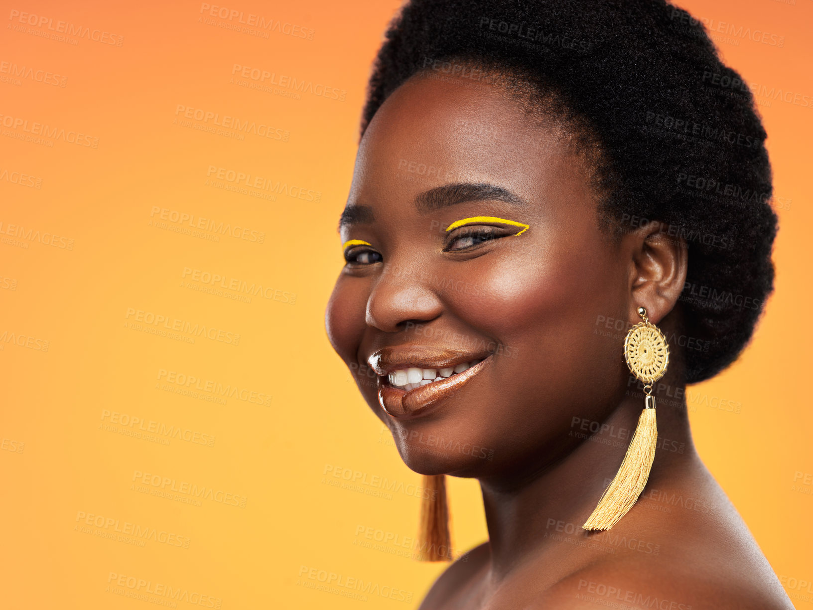 Buy stock photo Studio shot of a beautiful young woman posing against an orange background
