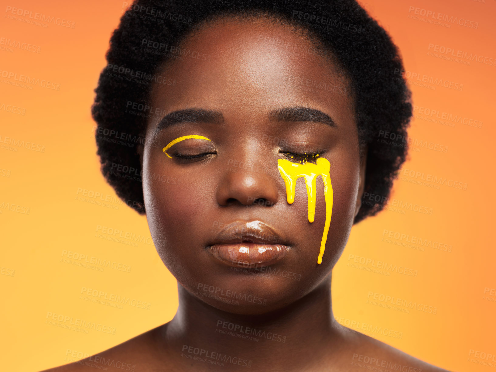 Buy stock photo Studio shot of a beautiful young woman posing against an orange background