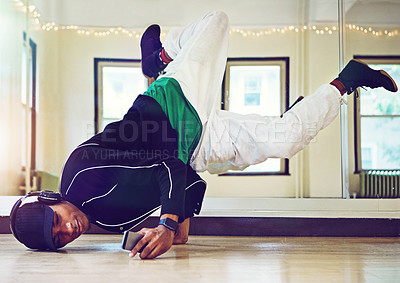 Buy stock photo Dancer, hip hop and practice performance in class with phone, music and motion for skill, training and art of dancing. Man, headphones and podcast for streetwear, energy and competition battle