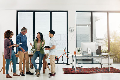 Buy stock photo Full length shot of four creative professionals talking in the office