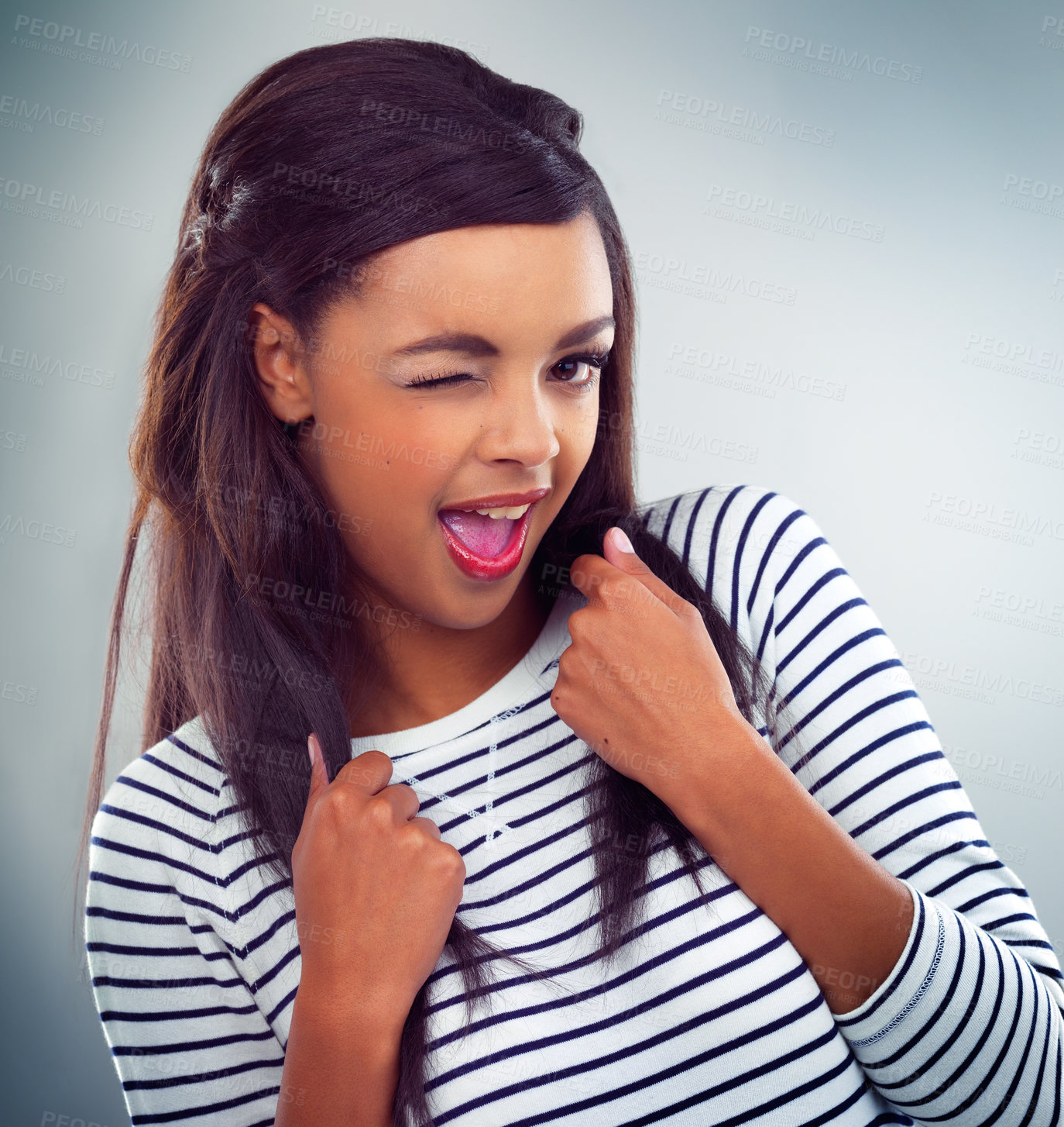 Buy stock photo Shot of a young woman posing against a grey background