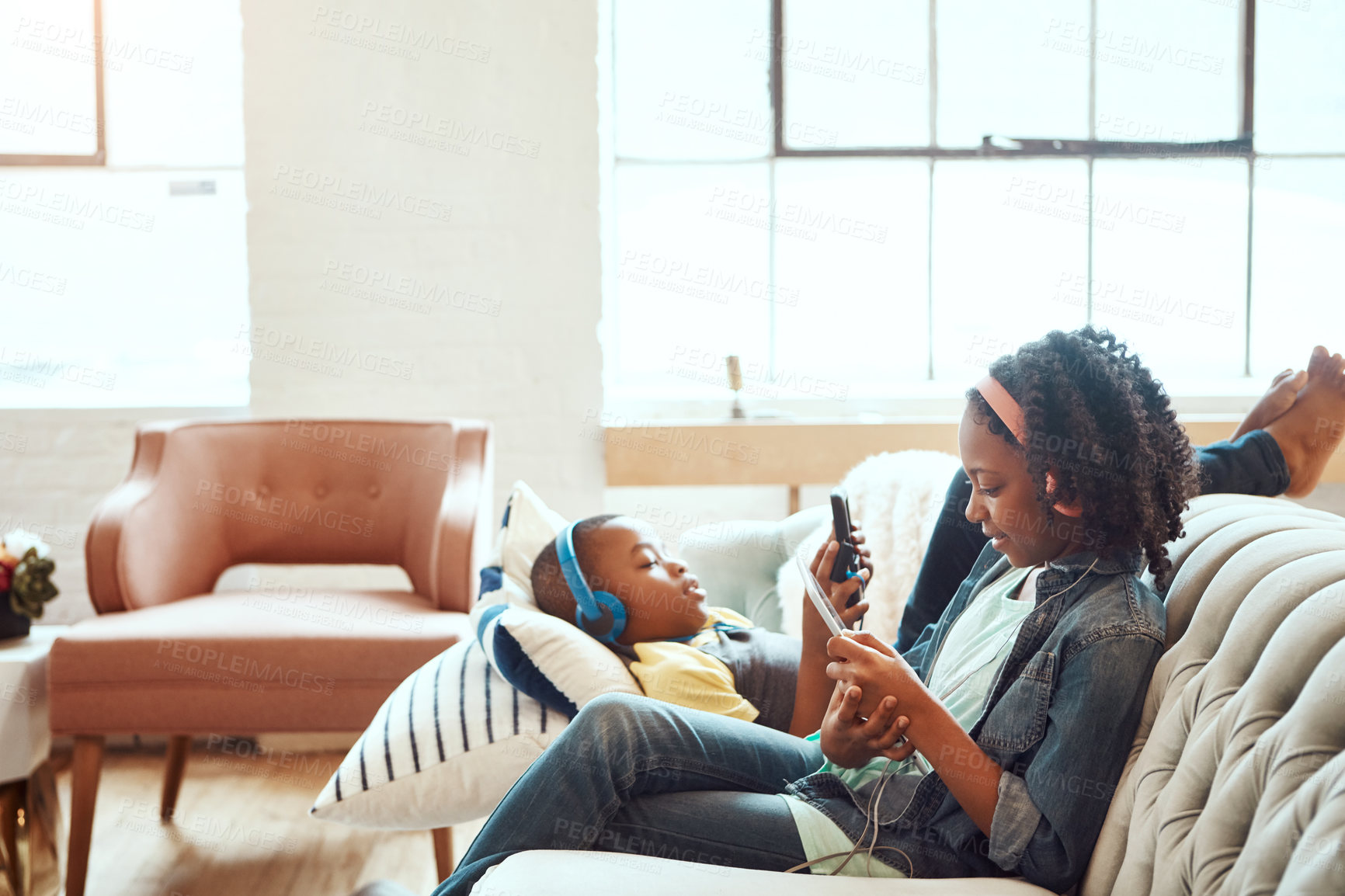 Buy stock photo Shot of a brother and sister having fun indoors