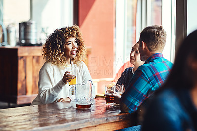 Buy stock photo Shot of a group of friends enjoying some beers at a bar