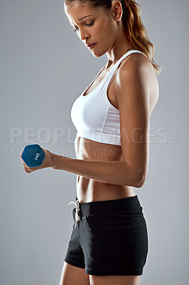 Buy stock photo Woman, fitness and weightlifting with dumbbell for workout, training or exercise on a gray studio background. Closeup of female person lifting weight for muscle gain, strength or bicep curl on mockup