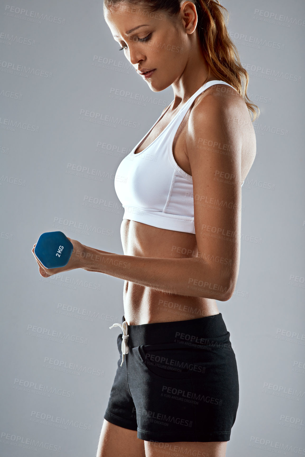 Buy stock photo Woman, fitness and weightlifting with dumbbell for workout, training or exercise on a gray studio background. Closeup of female person lifting weight for muscle gain, strength or bicep curl on mockup