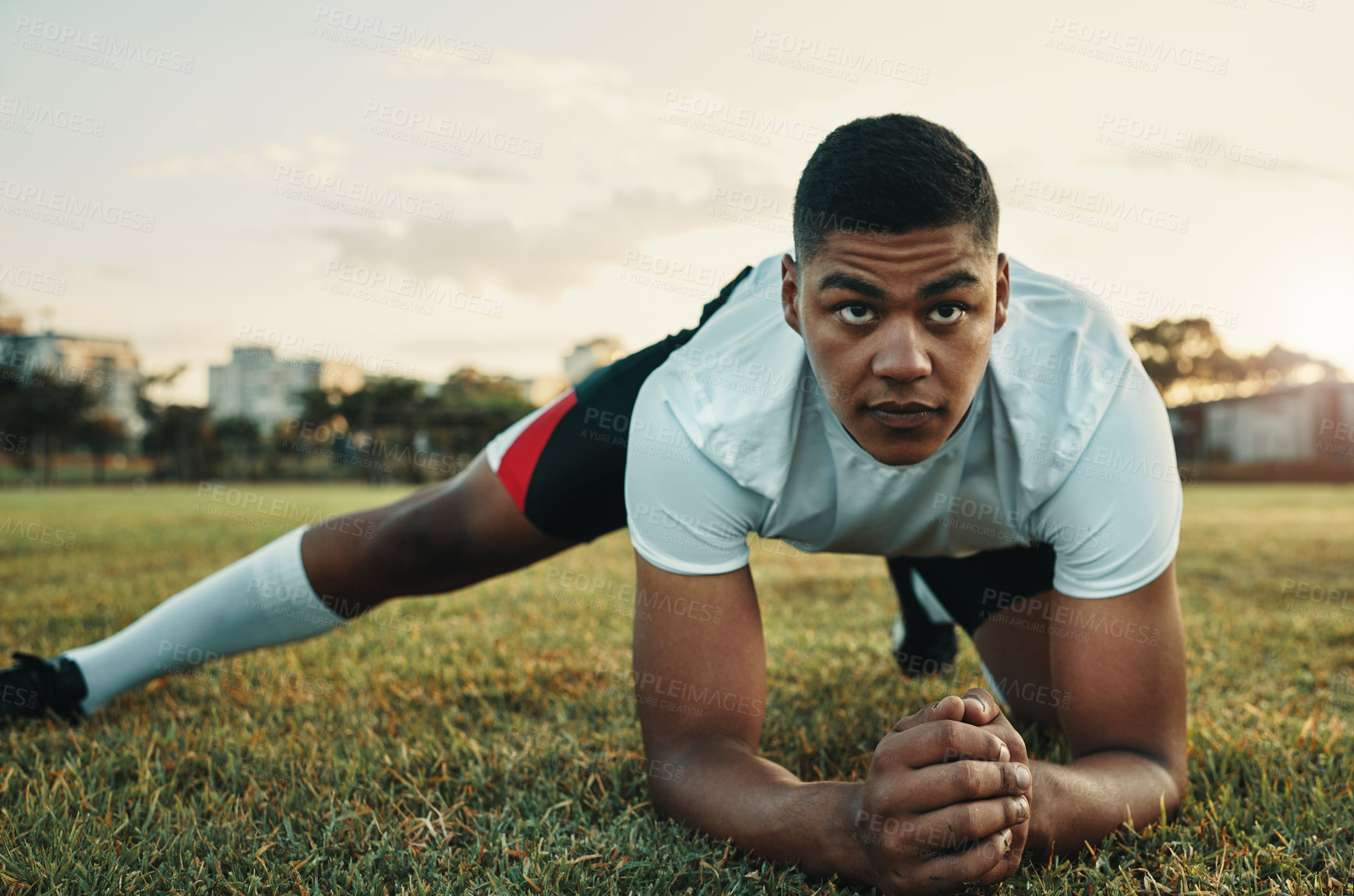 Buy stock photo Man, rugby and stretching for training, exercise and athlete legs on field with ready, match and practice. Workout, sport and player outdoor on grass for warm up, game and competition with motivation