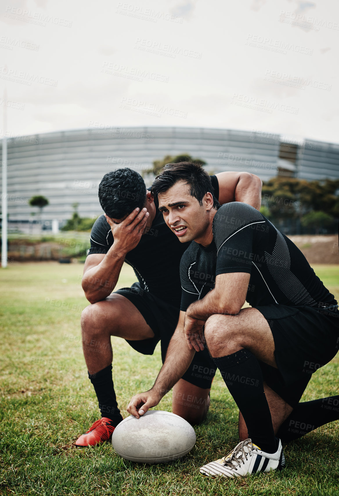 Buy stock photo Rugby, sad and men on field for loss in competition, tournament and training match in stadium. Crying, frustrated players and depressed sports athletes in practice trial with ball for mistake or fail