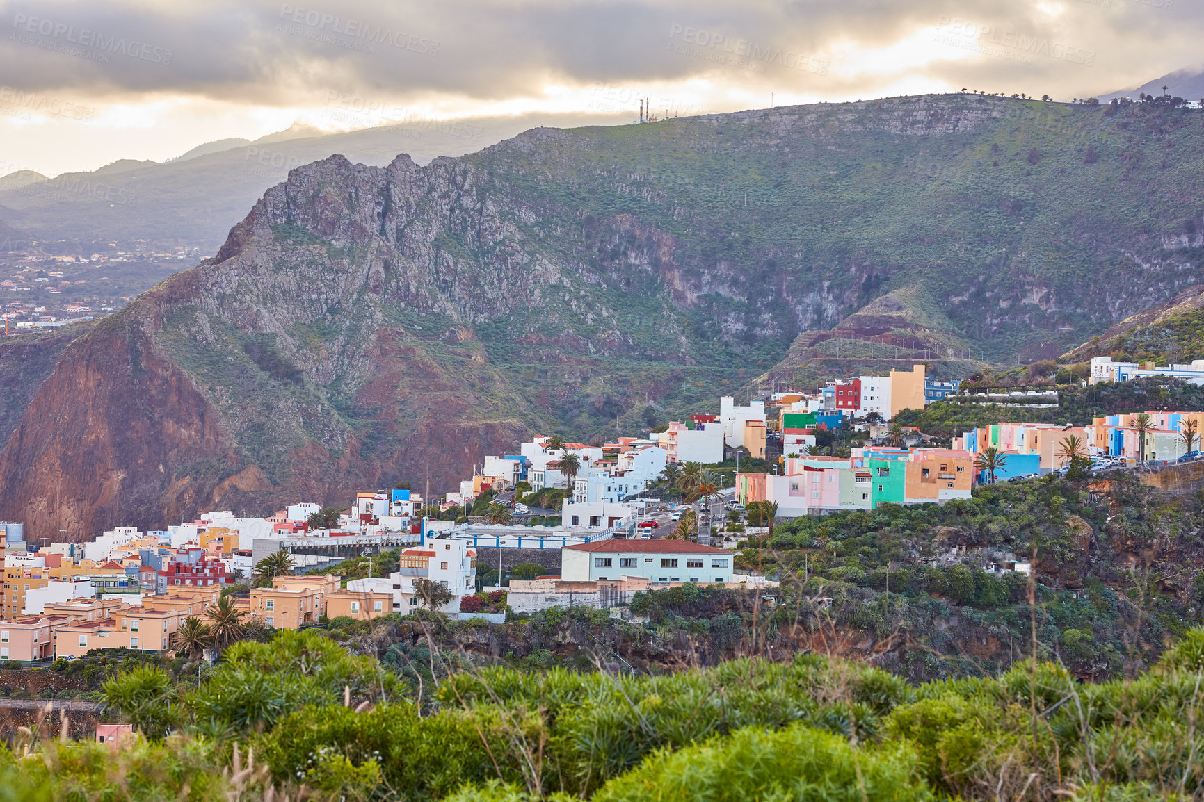 Buy stock photo Historical spanish or colonial architecture in tropical village in tourism destination. City and mountain view of residential houses or buildings in serene hill valley in Santa Cruz, La Palma, Spain.