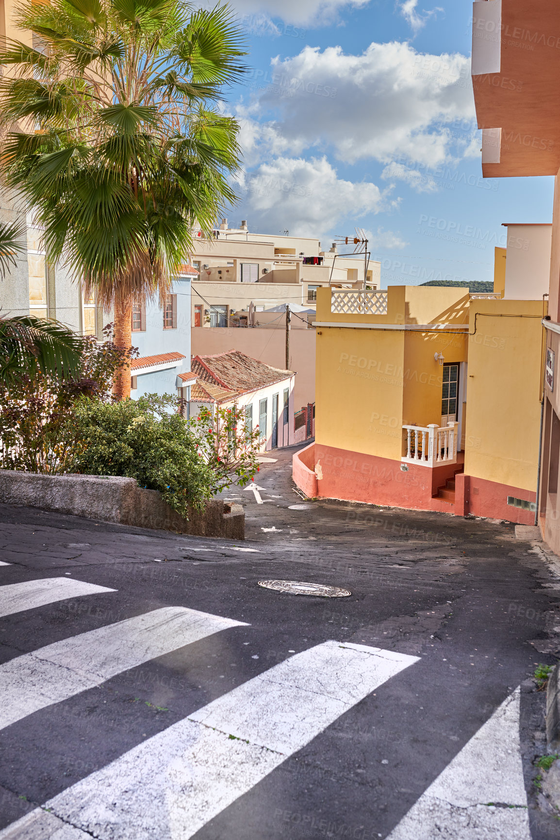 Buy stock photo A winding road with traditional architecture in 
Santa Cruz de La Palma. Quiet, empty street in a small European tourist city. A narrow alleyway in a rural town with colorful buildings and houses. 
