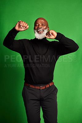 Buy stock photo Cropped shot of a senior man dancing against a green background