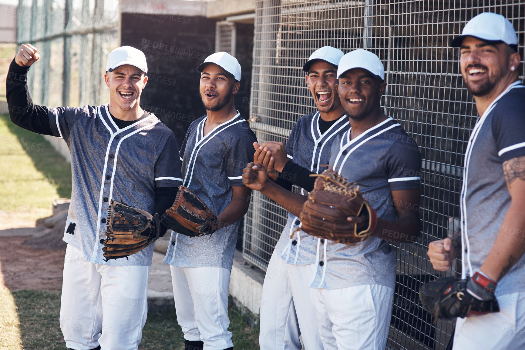 Buy stock photo Shot of a group of young baseball players celebrating after watching a game
