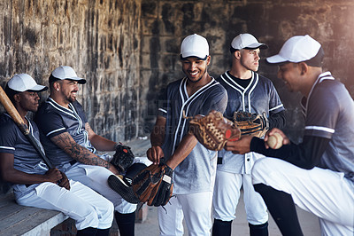 Buy stock photo Shot of a group of young baseball men in the dugout at a baseball game