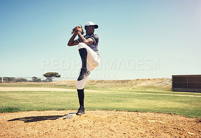 Buy stock photo Shot of a young man pitching a ball during a baseball match