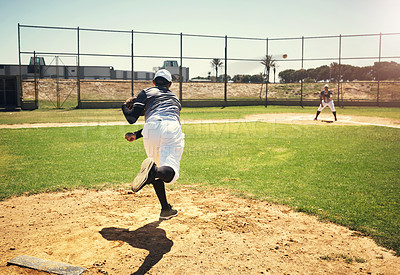 Buy stock photo Shot of a young man pitching a ball during a baseball match