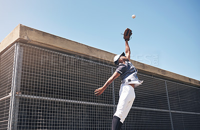 Buy stock photo Baseball, catch and man jump for ball in air at pitch for sports competition, action or game. Professional african athlete person playing outdoor for training, exercise and focus on fitness for sport