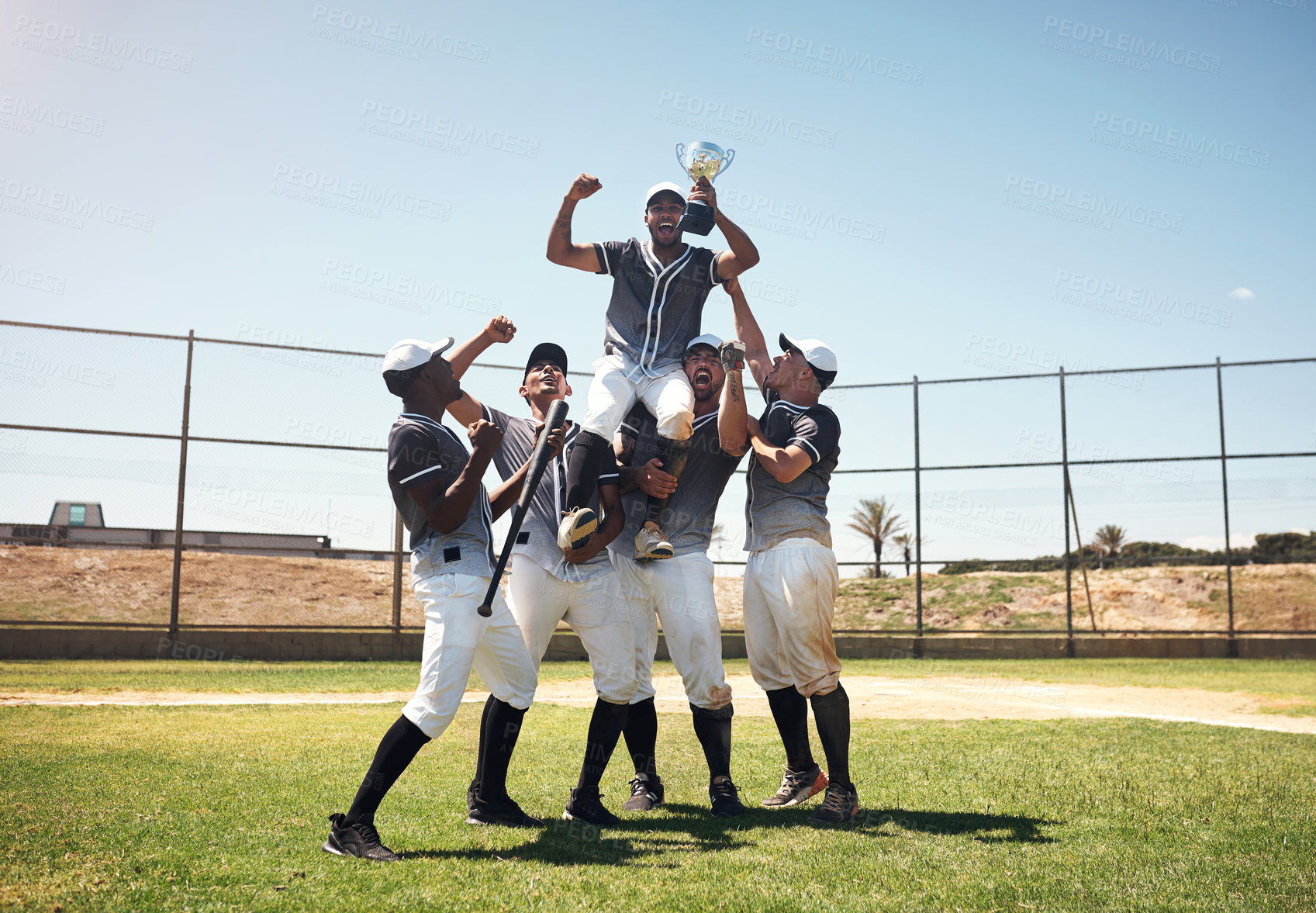 Buy stock photo Baseball field, men and team in celebration, trophy and prize for goals, performance or winning contest. People, group and diversity with support, cheers or happy on pitch for competition in Boston