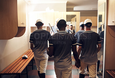 Buy stock photo Rearview shot of a group of young men walking out of the locker room at a baseball game