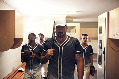 Buy stock photo Shot of a group of young men walking into a locker room at a baseball game