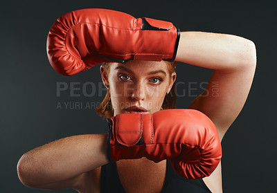 Buy stock photo Woman, boxing gloves and portrait as professional boxer on studio background for fitness or challenge. Female person, athlete and power for fight with strong muscle or pride for championship in sport