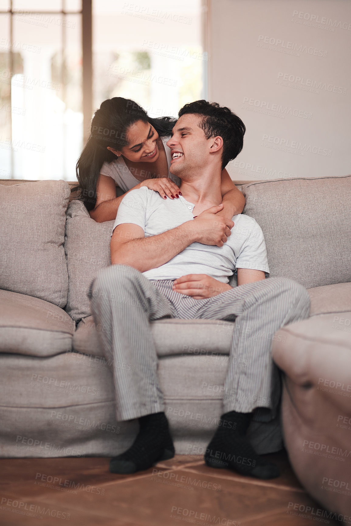 Buy stock photo Full length shot of an affectionate young couple in their living room at home
