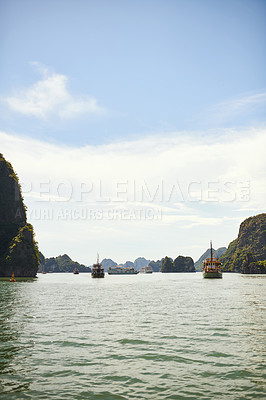 Buy stock photo Shot of boats floating down a river in Vietnam