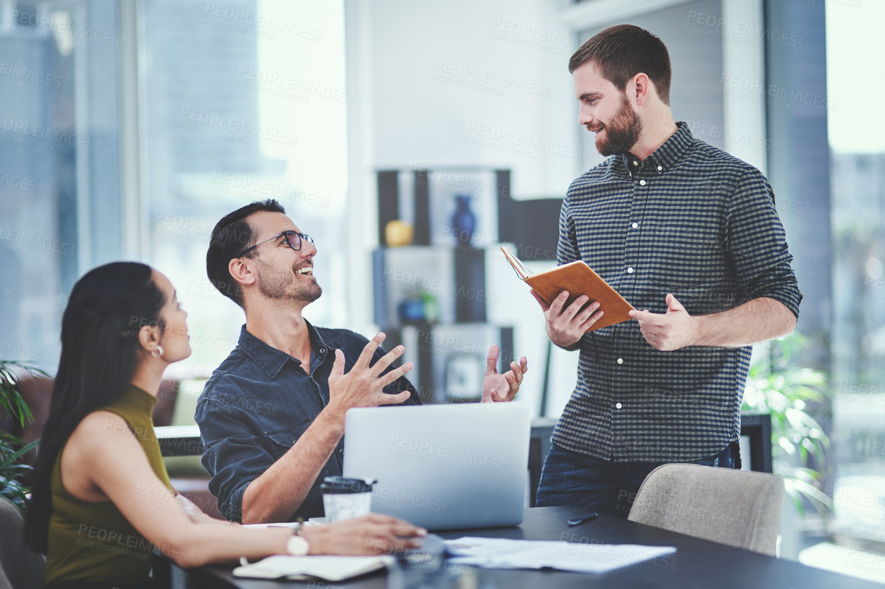 Buy stock photo Creative, business people and team discussion with book in meeting for brainstorming, coaching and solution. Happy group, training and planning with engagement manager for help or feedback in startup