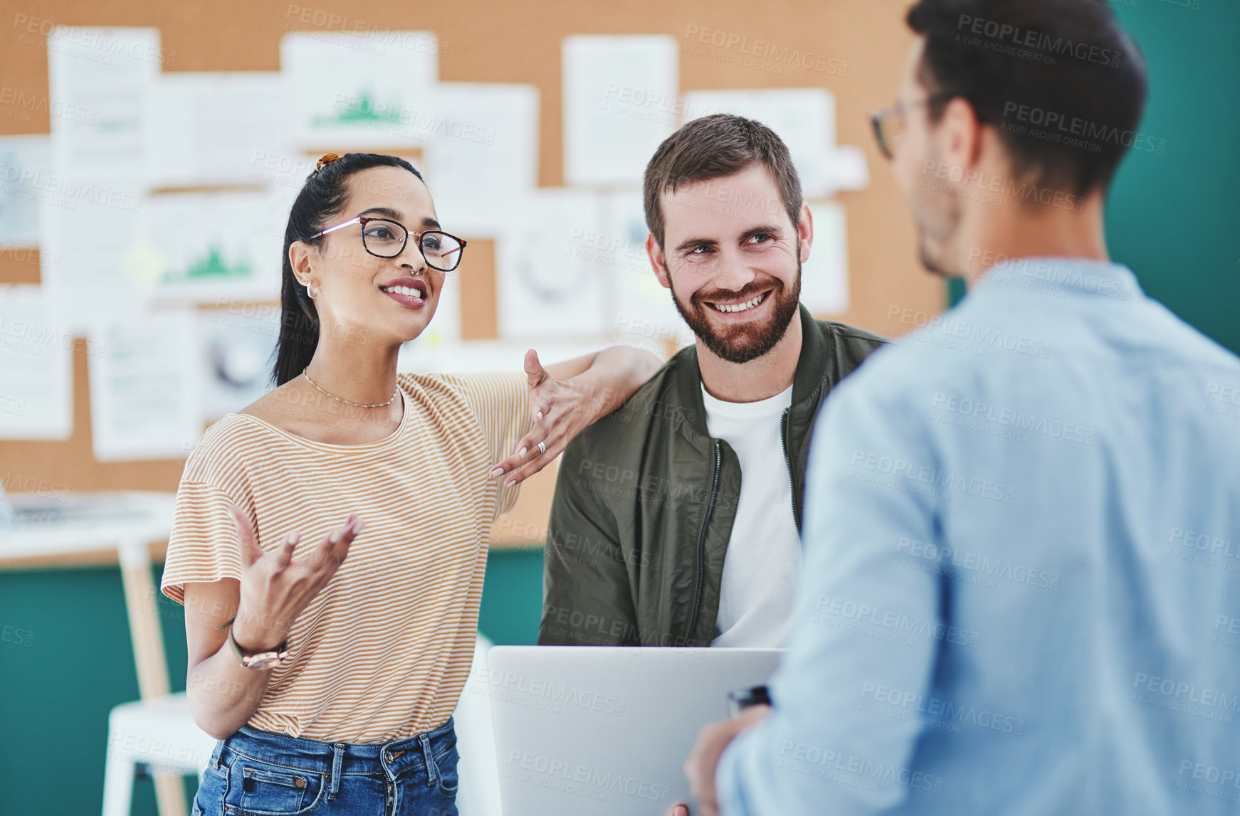 Buy stock photo Talking, teamwork and smile in office, people and planning for project, laptop and creative for deadline. Colleagues, confident and collaboration for journalism, newsroom and proud for discussion