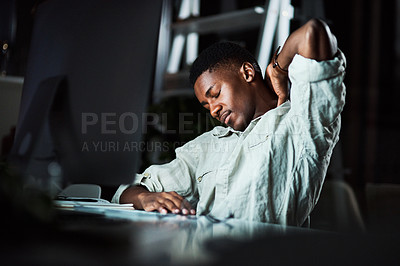 Buy stock photo Cropped shot of a businessman experiencing neck pain while working late at the office