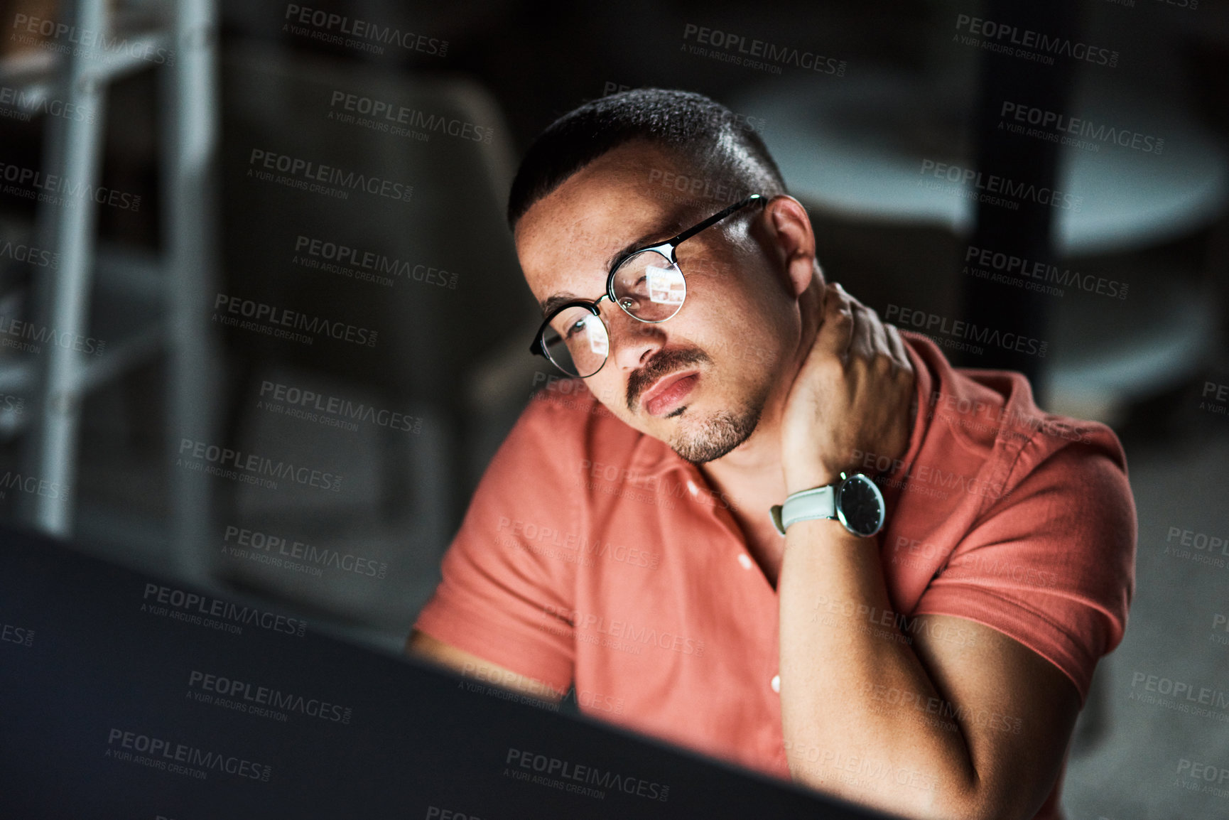 Buy stock photo Cropped shot of a businessman experiencing neck pain while working late at the office