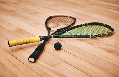 Buy stock photo Shot of two squash racquets on the floor of a squash court