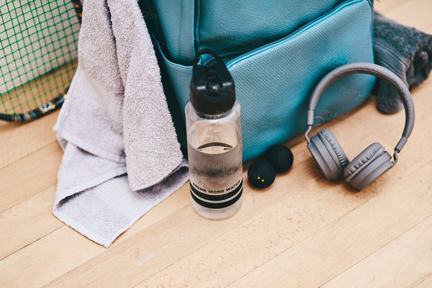 Buy stock photo Shot of a sports bag and other items in an empty squash court