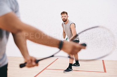 Buy stock photo Squash, man and racket serve at gym, competition and team for indoor fitness or tournament. Male person, friends and court for physical training or workout, practice gear and athletes for exercise