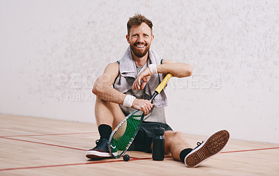 Buy stock photo Portrait of a young man taking a break after playing a game of squash