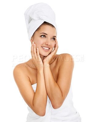Buy stock photo Cropped shot of a gorgeous young woman smiling while wrapped in towels against a white background