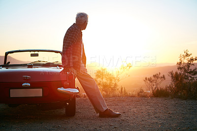 Buy stock photo Shot of a senior man out on a road trip