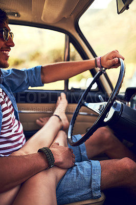 Buy stock photo Cropped shot of an affectionate young couple taking a roadtrip together