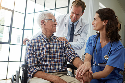 Buy stock photo Cropped shot of a senior man in the retirement home with his doctor and nurse