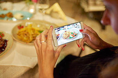 Buy stock photo Cropped shot of an unrecognizable woman taking a picture of her food