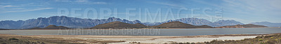 Buy stock photo Shot of a desolate landscape during the day with a small dried out dam in the middle with the words 