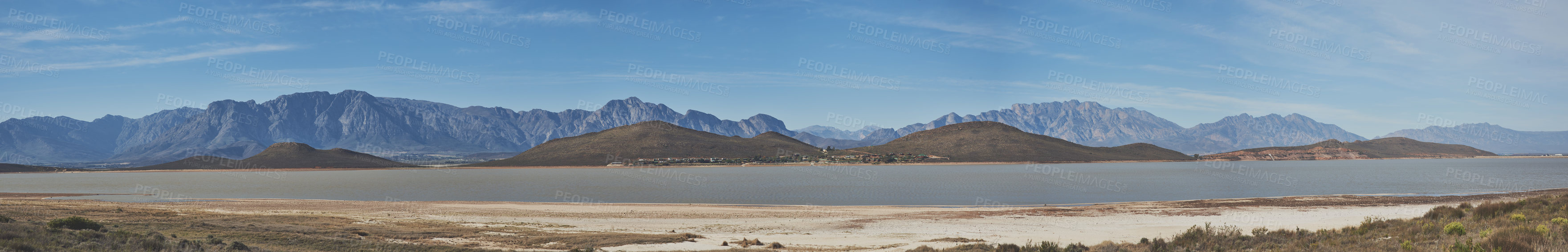 Buy stock photo Shot of a desolate landscape during the day with a small dried out dam in the middle with the words 