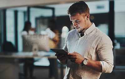 Buy stock photo Night, tablet and internet with man in office for network, communication or administration. Auditor, processing clerk and booking report with person in finance agency for system record and feedback